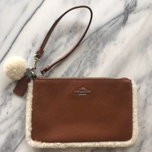 ⬇️NWOT Coach brown and fur wristlet